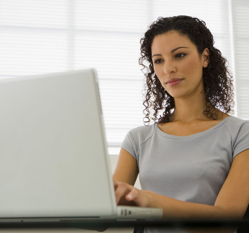 Women applying for a loan on a laptop computer